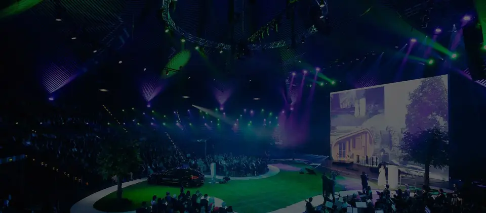 The gala hall, full, under green light