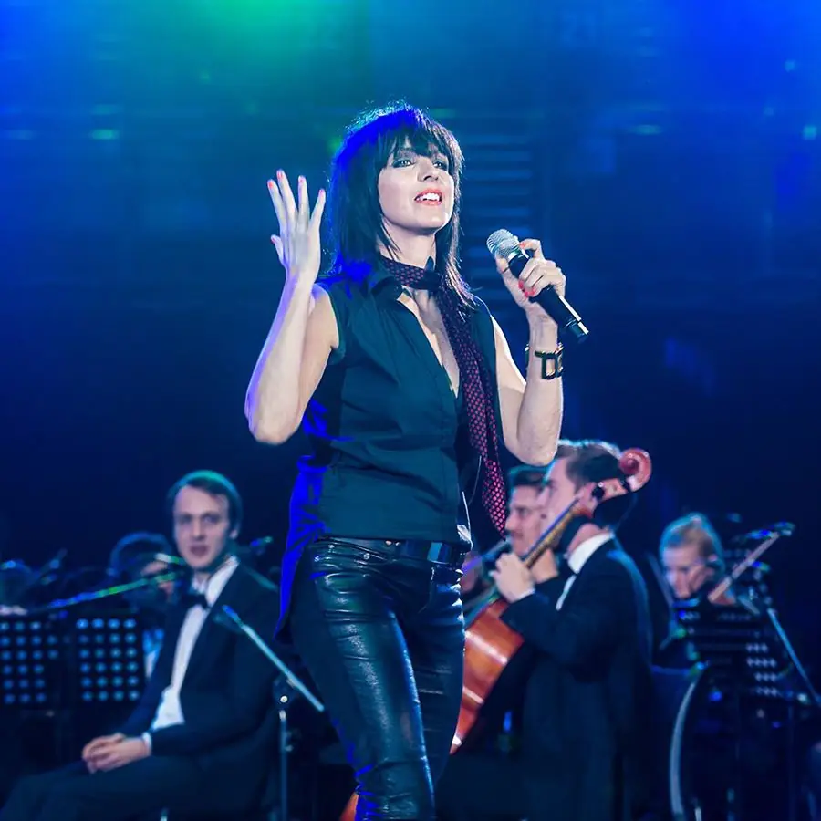 A singer on stage with the orchestra