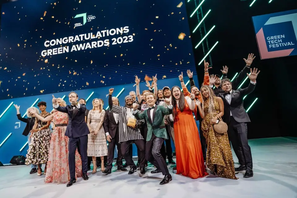 Winners on stage under confetti at the GREEN AWARDS